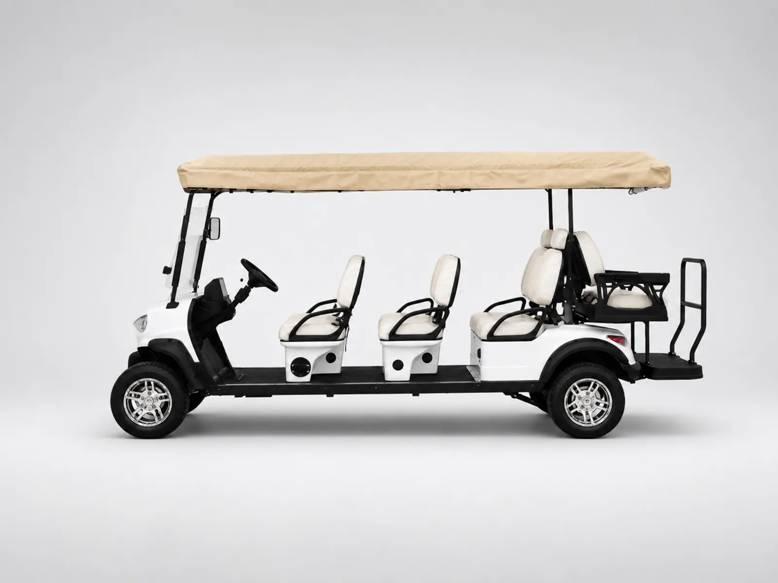 White eight-passenger shuttle with six forward-facing seats and a two-seat rear-facing bench